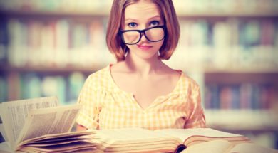 Funny Girl Student With Glasses Reading Books